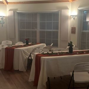 7 ivory polyester table cloths and 7 rust orange runners used for wedding once.